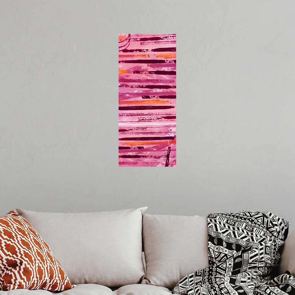 A bohemian room featuring Tall abstract painting with horizontal lines in shades of pink, orange, and red.