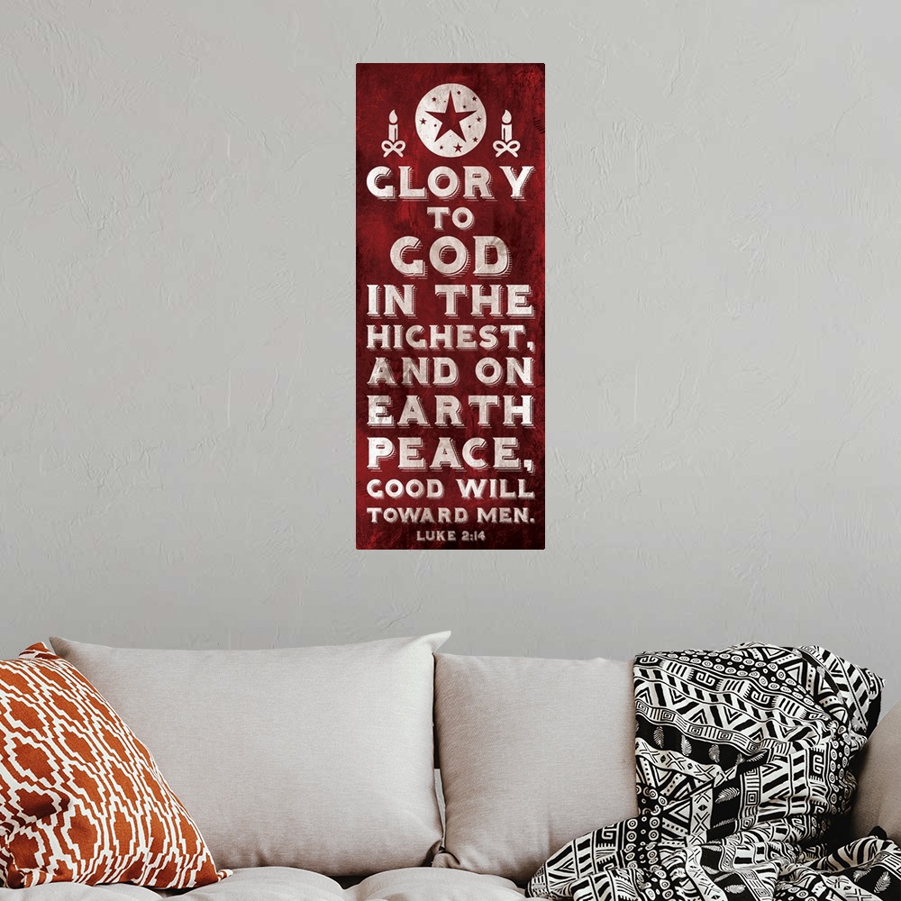 A bohemian room featuring Vertical Christmas themed typography art of the Bible verse Luke 2:14 in white text on red.