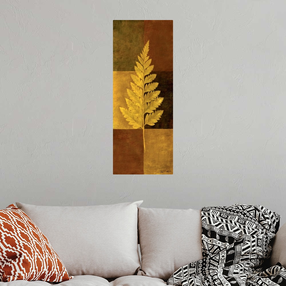 A bohemian room featuring Long vertical decorative art of a single fern leaf in gold with a checkered earth toned background.
