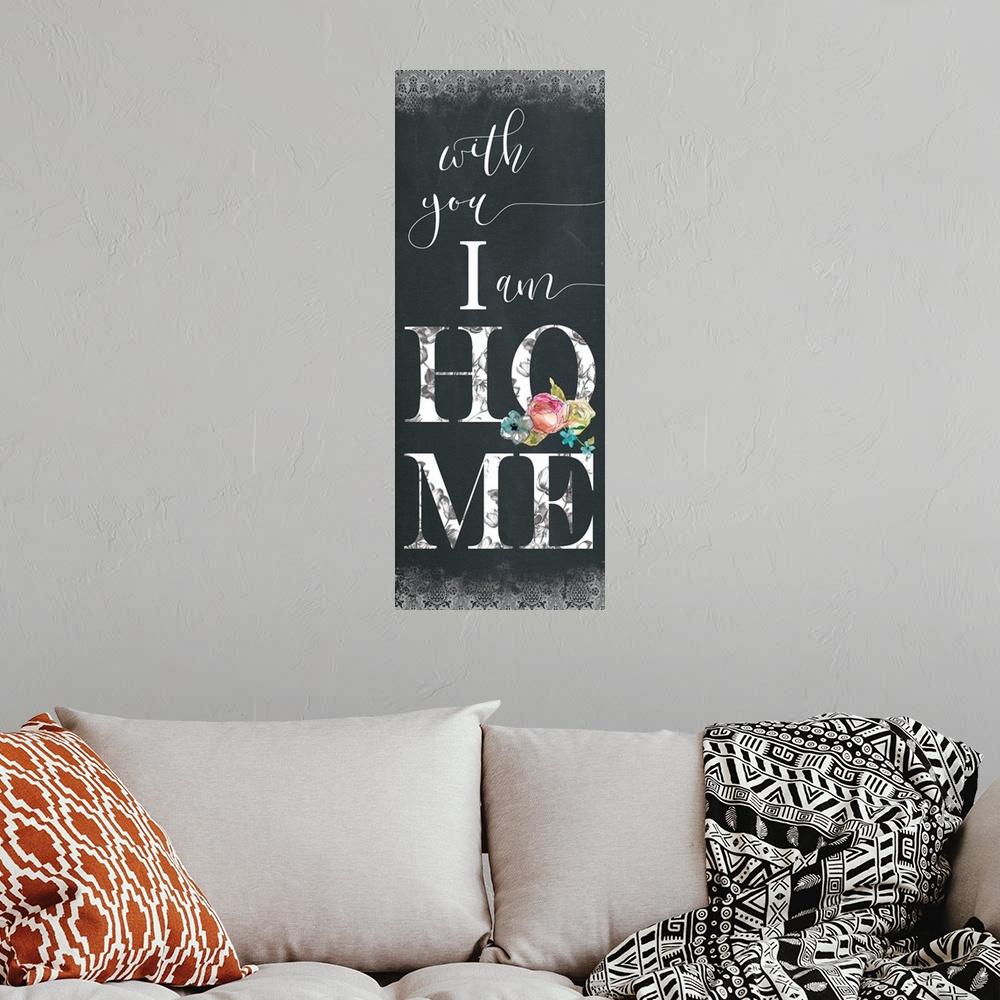 A bohemian room featuring Panel typography with a chalkboard feel that reads "with you I am Home" with a decorative pattern...