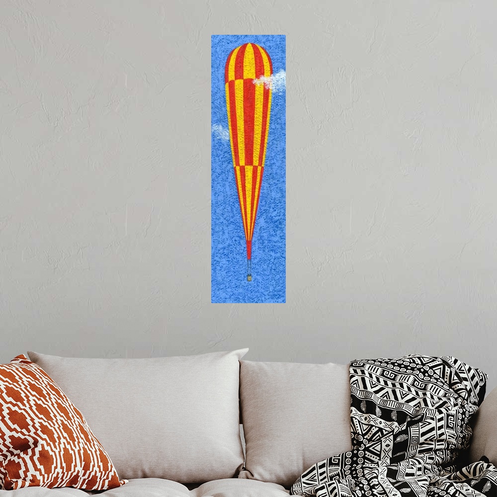 A bohemian room featuring Contemporary painting of a tall yellow and red striped hot air balloon against a blue sky.