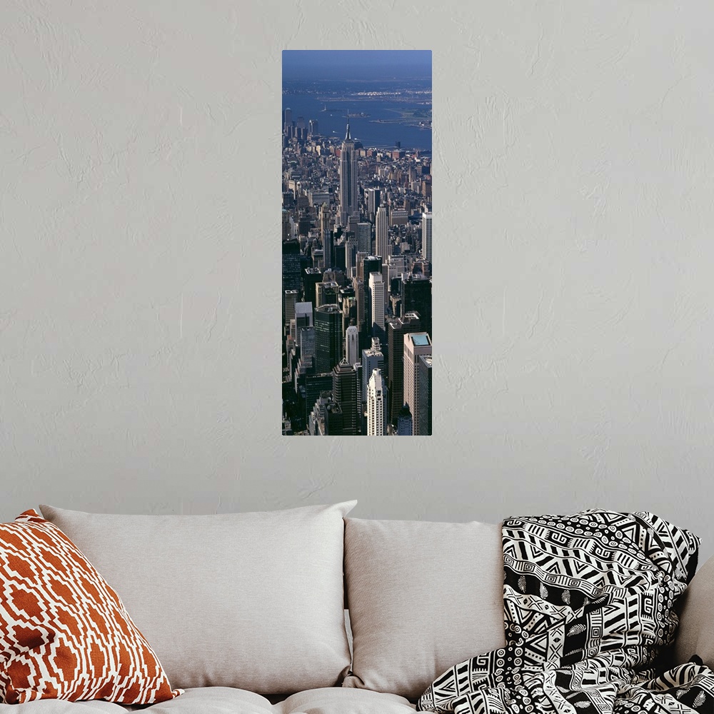 A bohemian room featuring Skyscrapers in New York City are photographed from an aerial view and in vertical orientation.