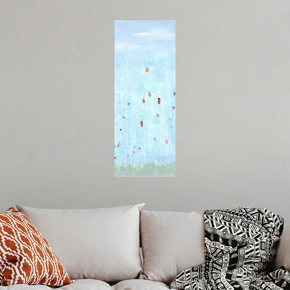 A bohemian room featuring Large panel painting of tall flowers on faint white stems coming up from faded green grass and li...
