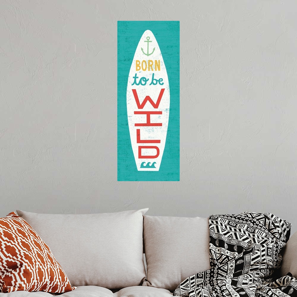 A bohemian room featuring "Born to Be Wild" surfboard decorated with an anchor and waves on a blue background.