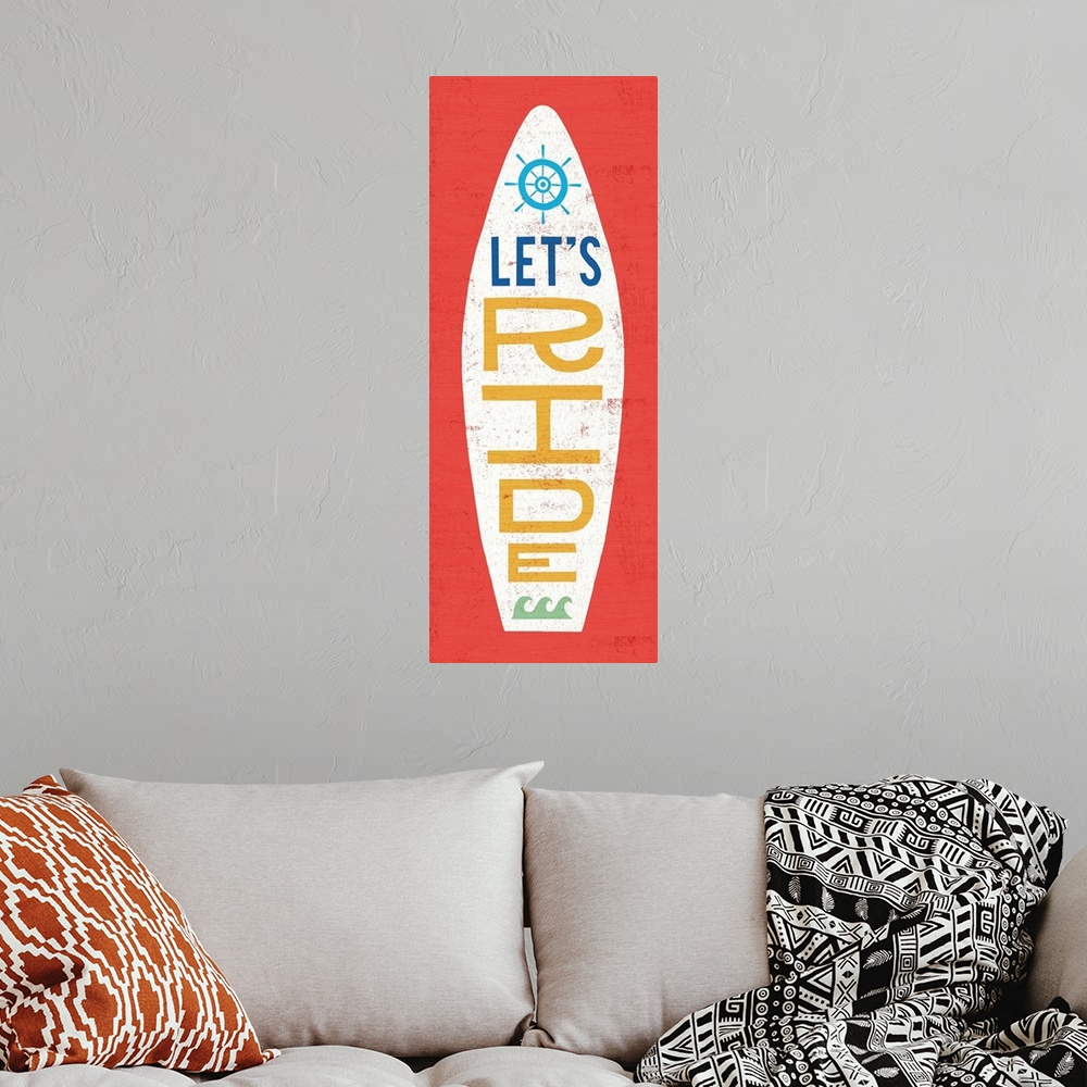 A bohemian room featuring "Let's Ride" surfboard decorated with waves and a helm on a red background.
