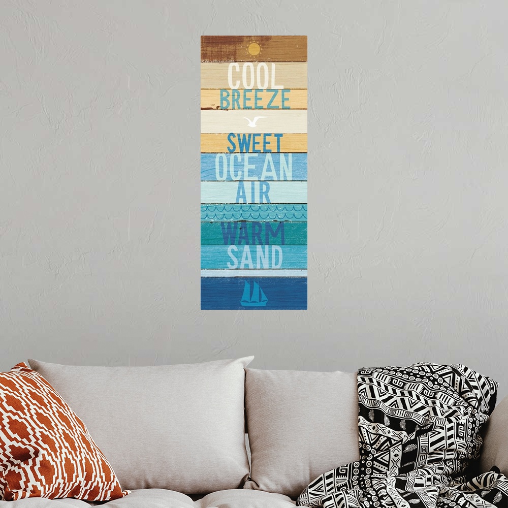 A bohemian room featuring "Cool Breeze- Sweet Ocean Air- Warm Sand" on a blue and tan wood paneled background.