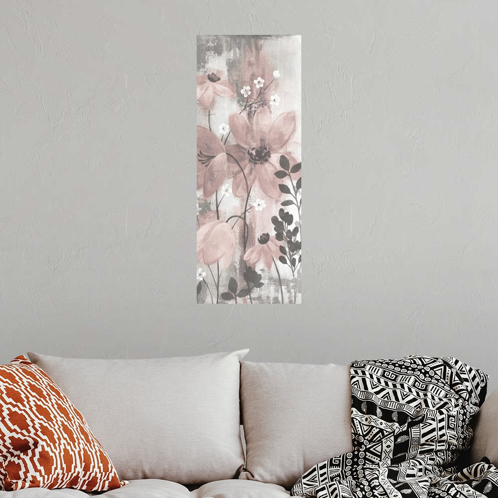 A bohemian room featuring Contemporary artwork of pink flowers over a distressed gray background.