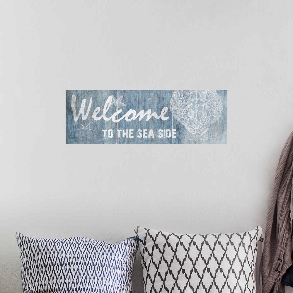 A bohemian room featuring "Welcome to the Sea Side"