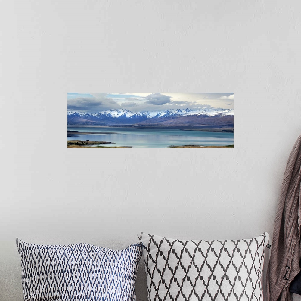 A bohemian room featuring Lake Tekapo, with snow covered mountains. Tekapo, New Zealand.