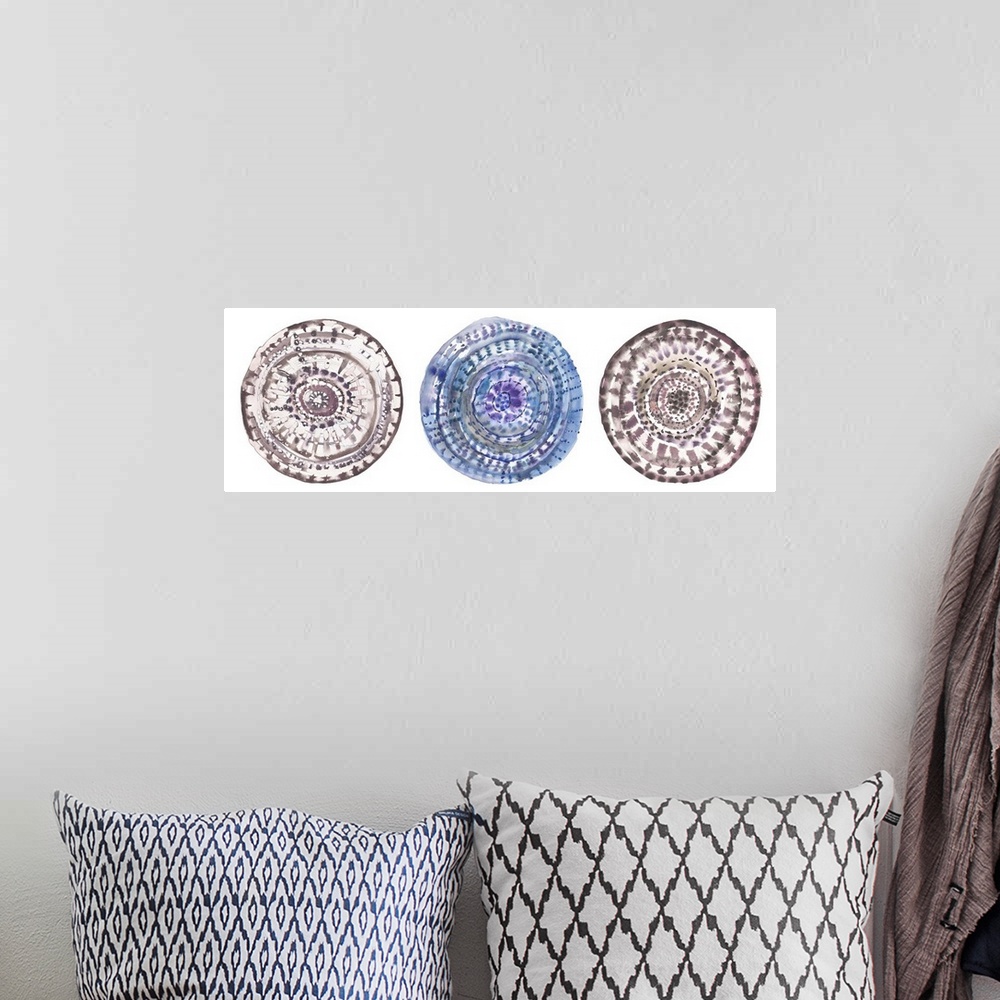 A bohemian room featuring Three circular watercolor shapes with swirls and patterns.