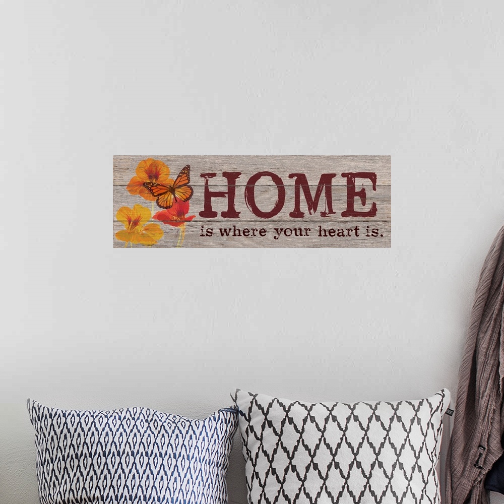 A bohemian room featuring Contemporary family art using flowers and typography on a rustic looking wooden surface.