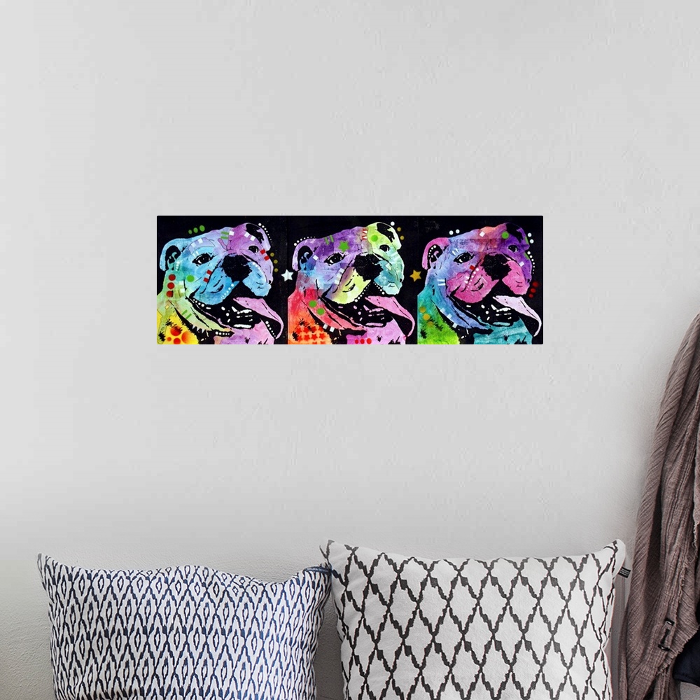 A bohemian room featuring Three colorful bulldogs lined up next to each other with their tongues hanging out on a black bac...