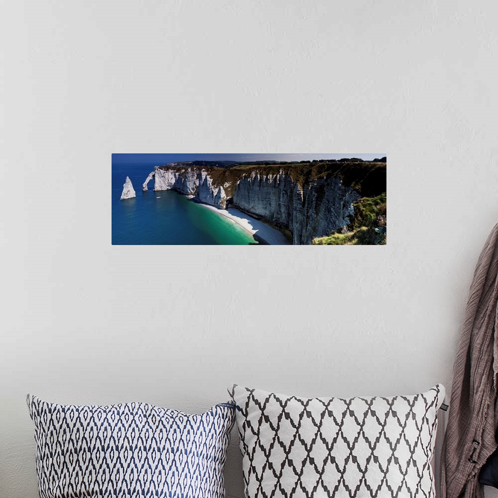 A bohemian room featuring Panoramic photograph of the cliffs at Etretat, France.