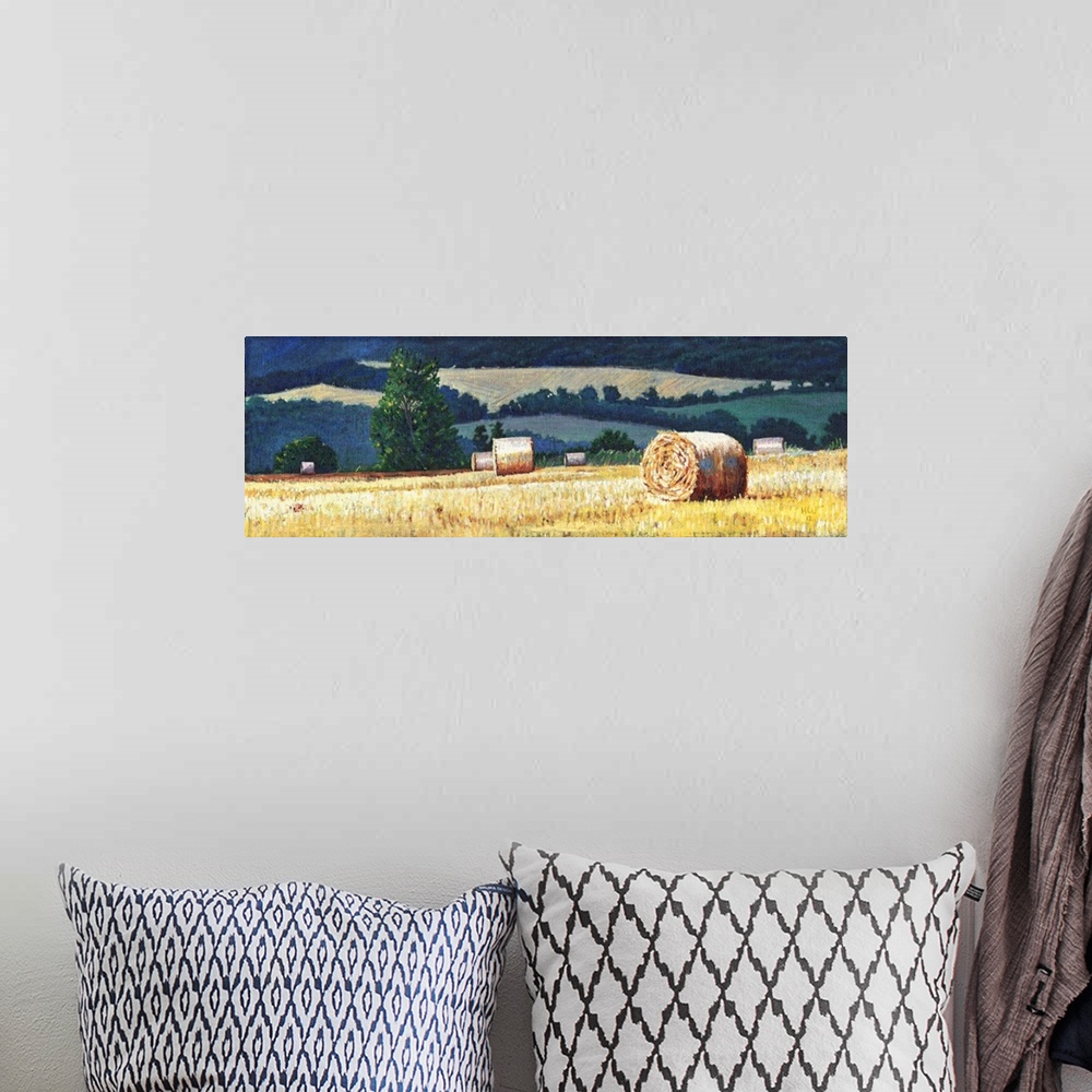 A bohemian room featuring Contemporary painting of a countryside scene with hay bails in a farmed field.