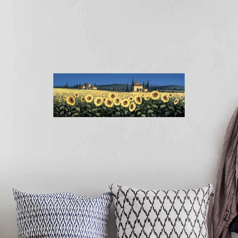 A bohemian room featuring Contemporary artwork of a field of sunflowers in Tuscany.