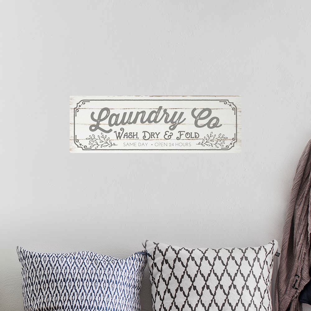 A bohemian room featuring Typographic laundry art on a shiplap wood background.