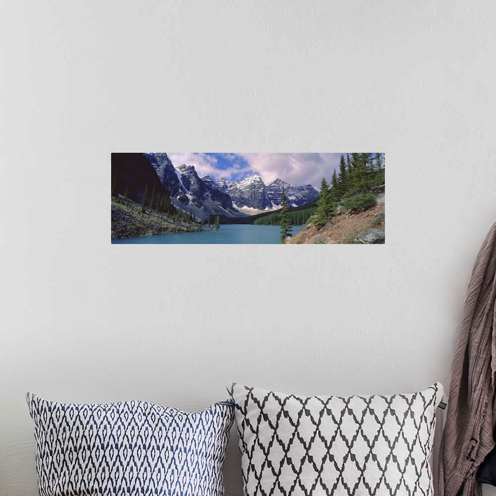 A bohemian room featuring Canada, Alberta, Moraine Lake. Clouds hide the peaks of Moraine Lake in the Valley of the Ten Pea...