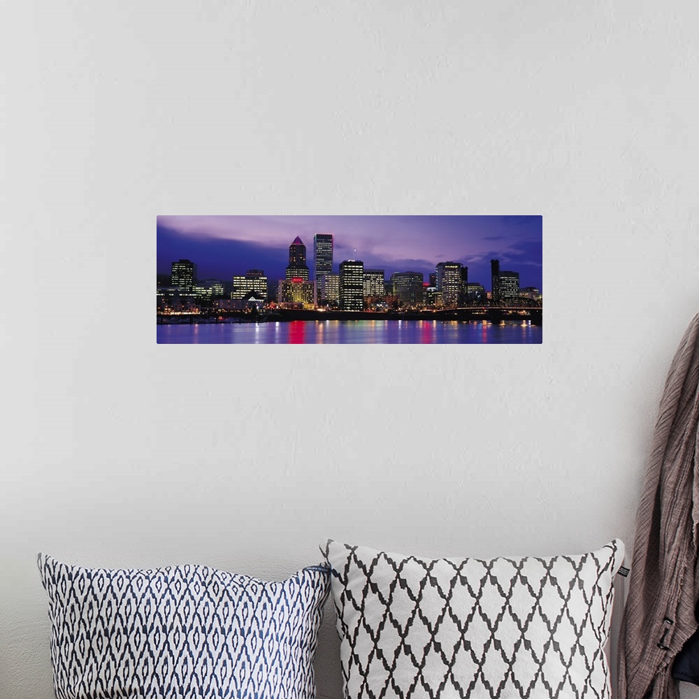 A bohemian room featuring Panoramic photograph on a big canvas of brightly lit buildings of the Portland skyline, reflectin...