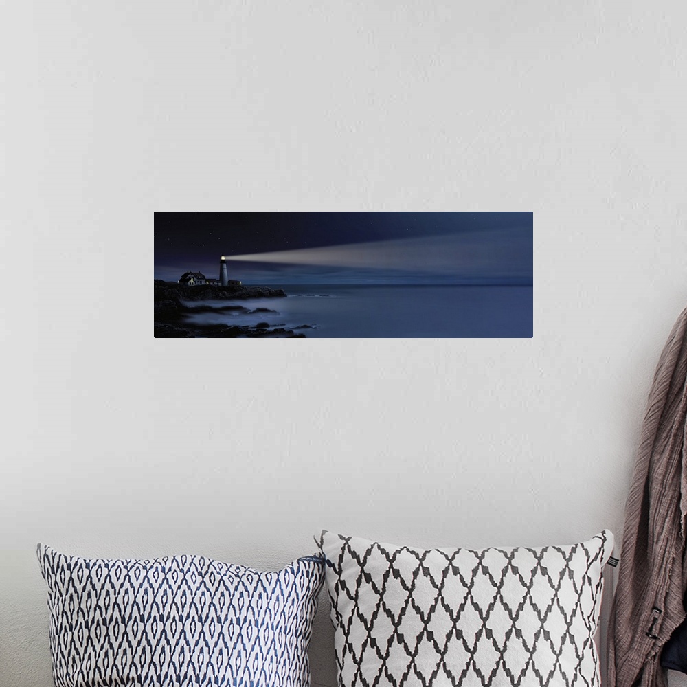 A bohemian room featuring Digital art painting of a lighthouse shining over the sea.