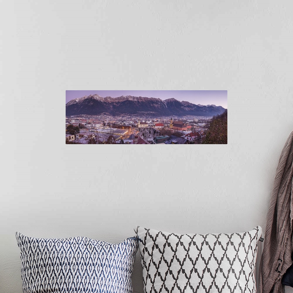 A bohemian room featuring Austria, Tyrol,  Innsbruck, elevated city view with the Wilten Basilica and Wilten Abbey Church, ...