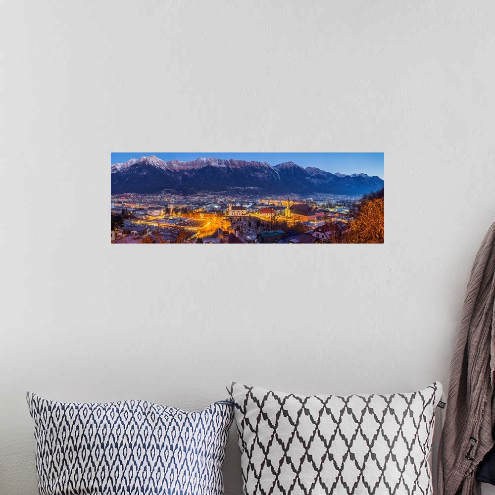 A bohemian room featuring Austria, Tyrol,  Innsbruck, elevated city view with the Wilten Basilica and Wilten Abbey Church, ...