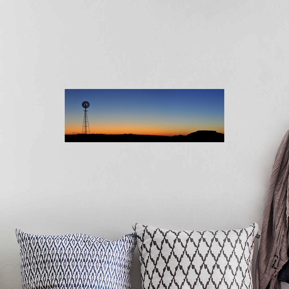 A bohemian room featuring Old west windmill at sunset, Pawnee National Grassland, Colorado, USA