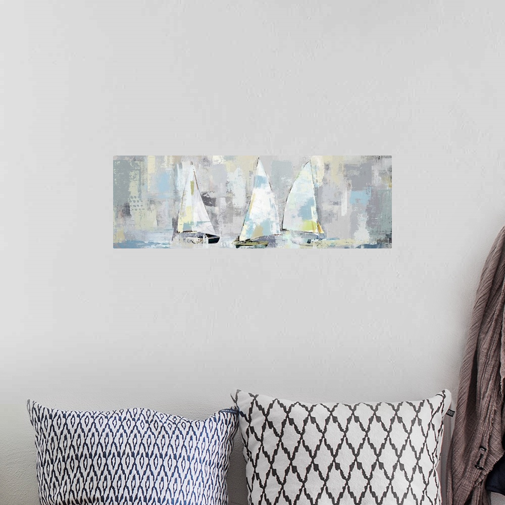 A bohemian room featuring A large panoramic painting of a group of sailboats with muted patches of yellow, blue and gray.