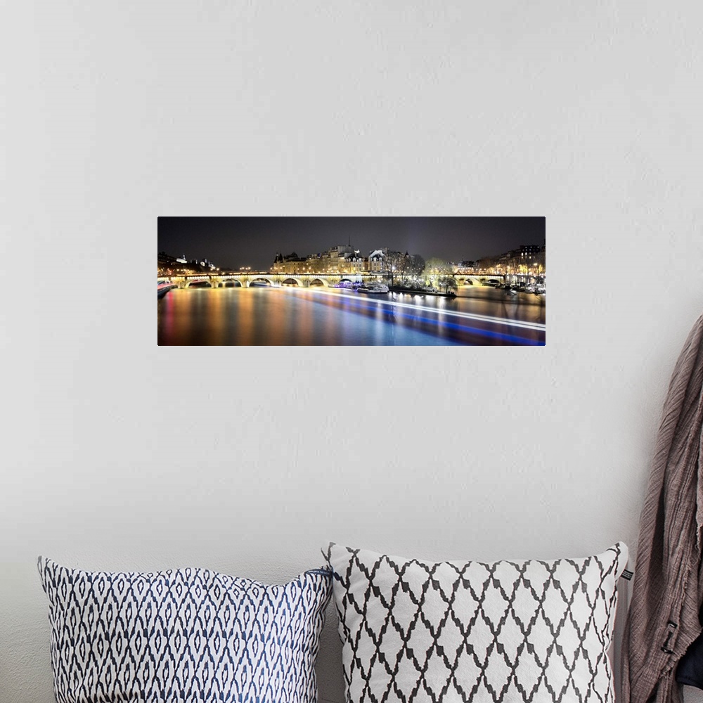 A bohemian room featuring Night long time exposure view of Paris from pont des arts bridge on Seine river with lignting bri...