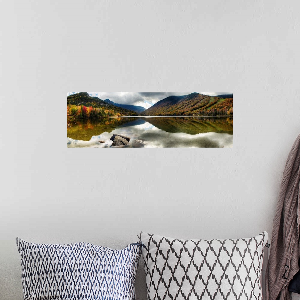 A bohemian room featuring Fine art photo of mountains reflected in a lake in New Hampshire in autumn.