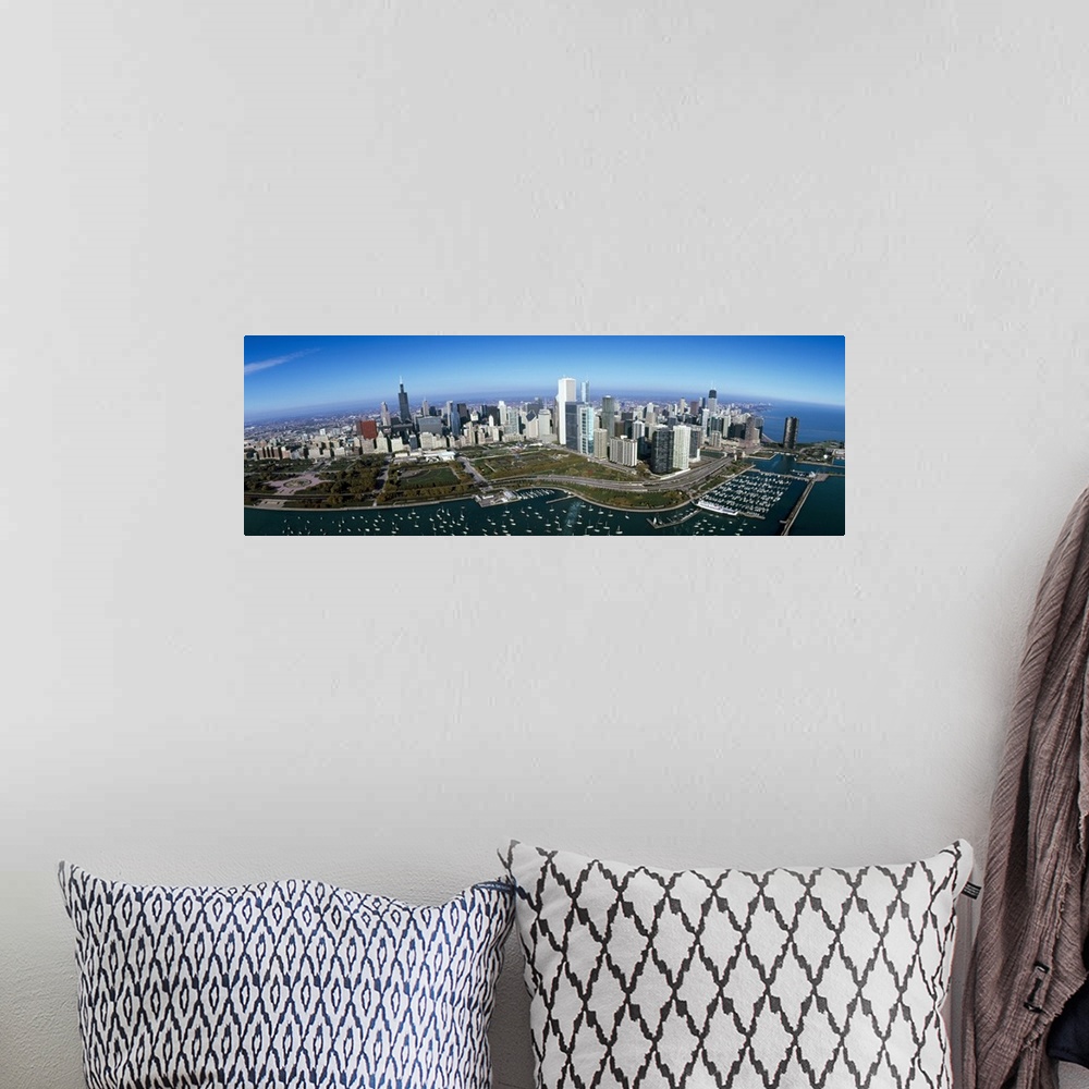 A bohemian room featuring Panoramic photo canvas art of the Chicago cityscape with boats in the harbor seen from above.