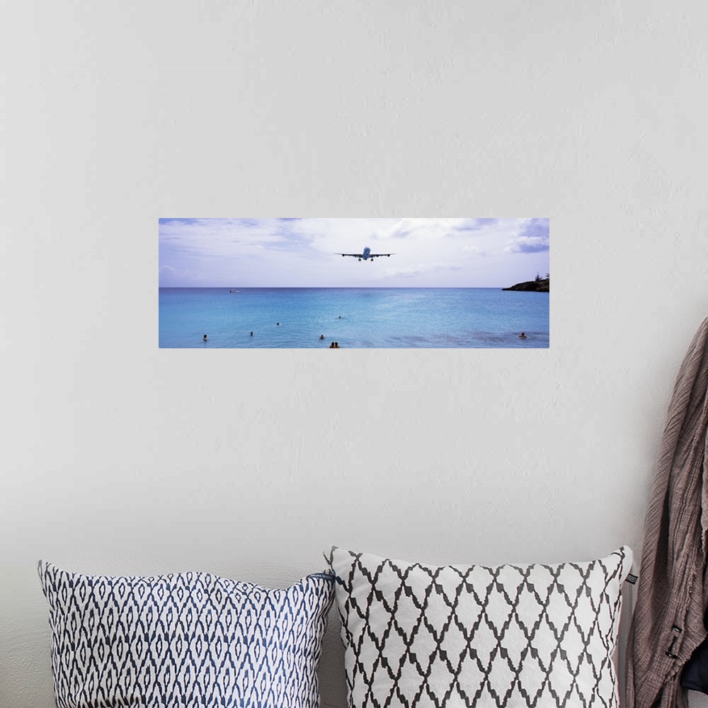 A bohemian room featuring Airplane flying over the sea, Maho Beach, Sint Maarten, Netherlands Antilles