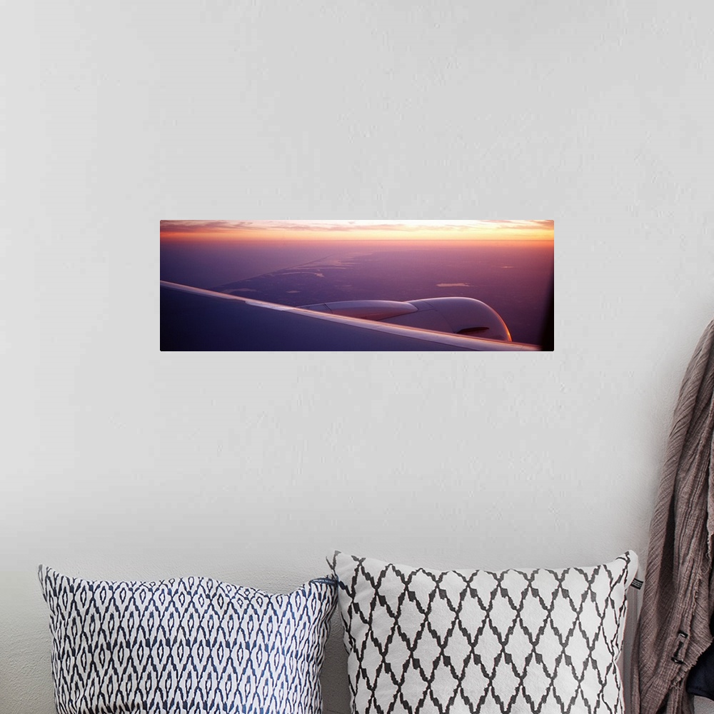 A bohemian room featuring Airplane wing at dusk