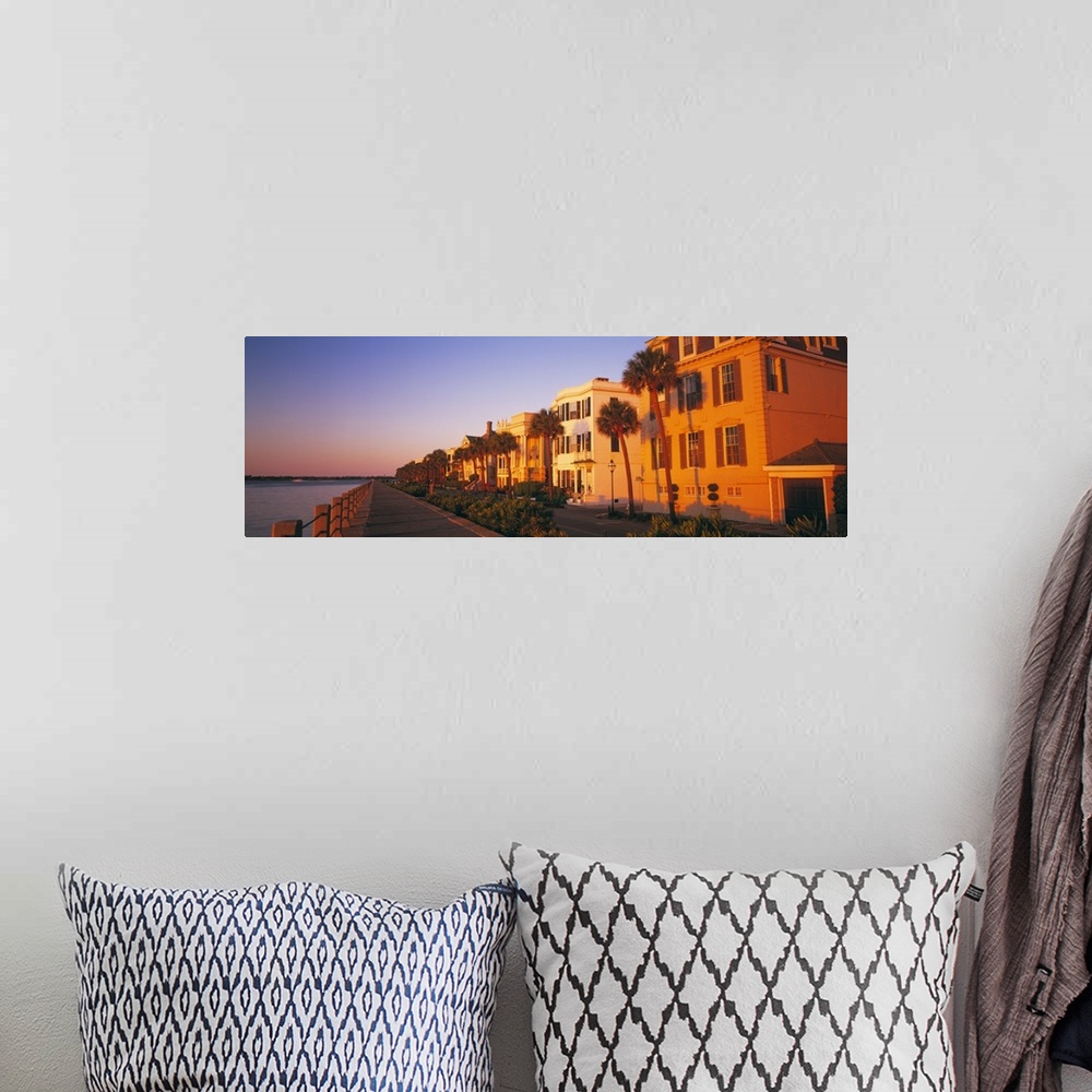 A bohemian room featuring Panoramic photograph shows a group of homes lining the streets of a beach town in the Southeaster...