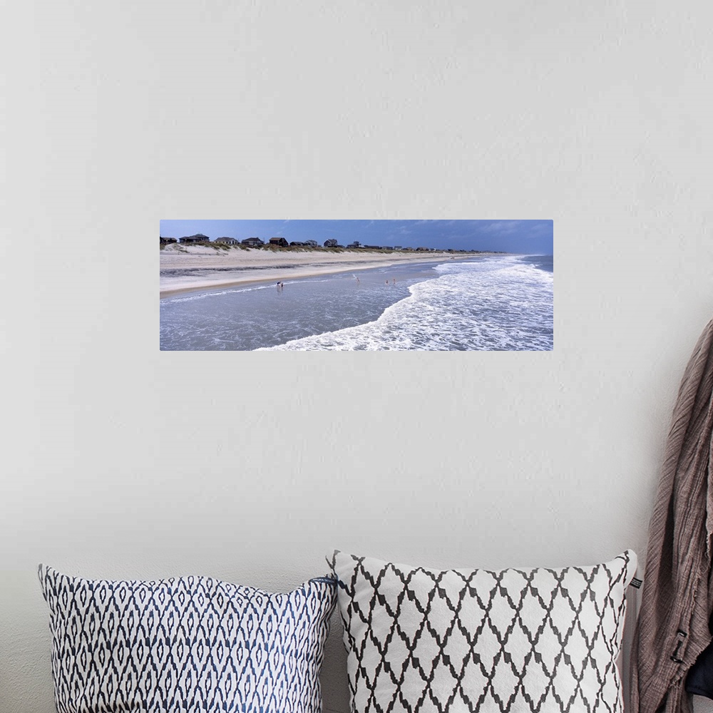 A bohemian room featuring Landscape, large photograph of the shoreline at an angle on Hatteras Beach in North Carolina.  A ...