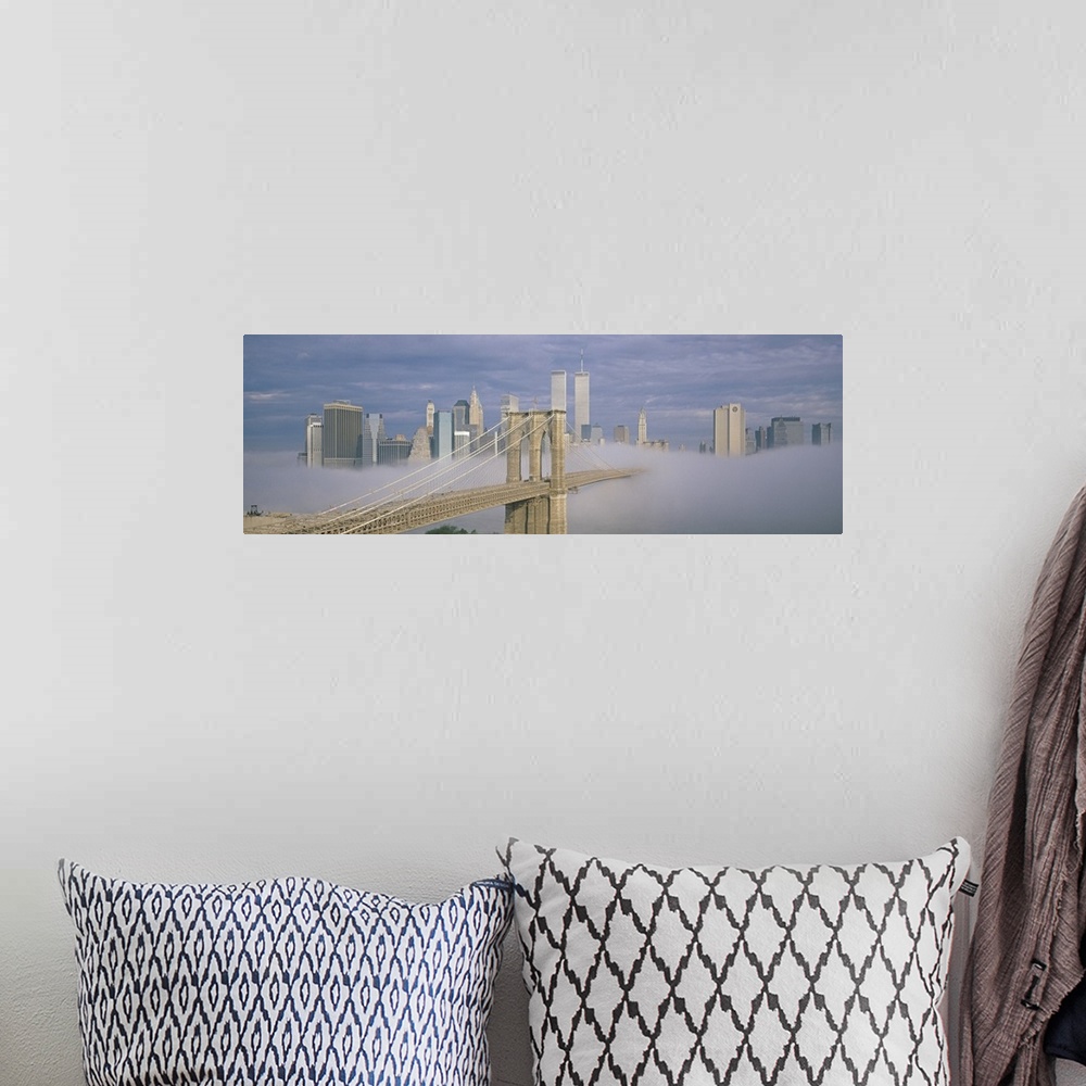 A bohemian room featuring Panoramic photo on canvas of a bridge leading to the NYC skyline poking out of the fog.