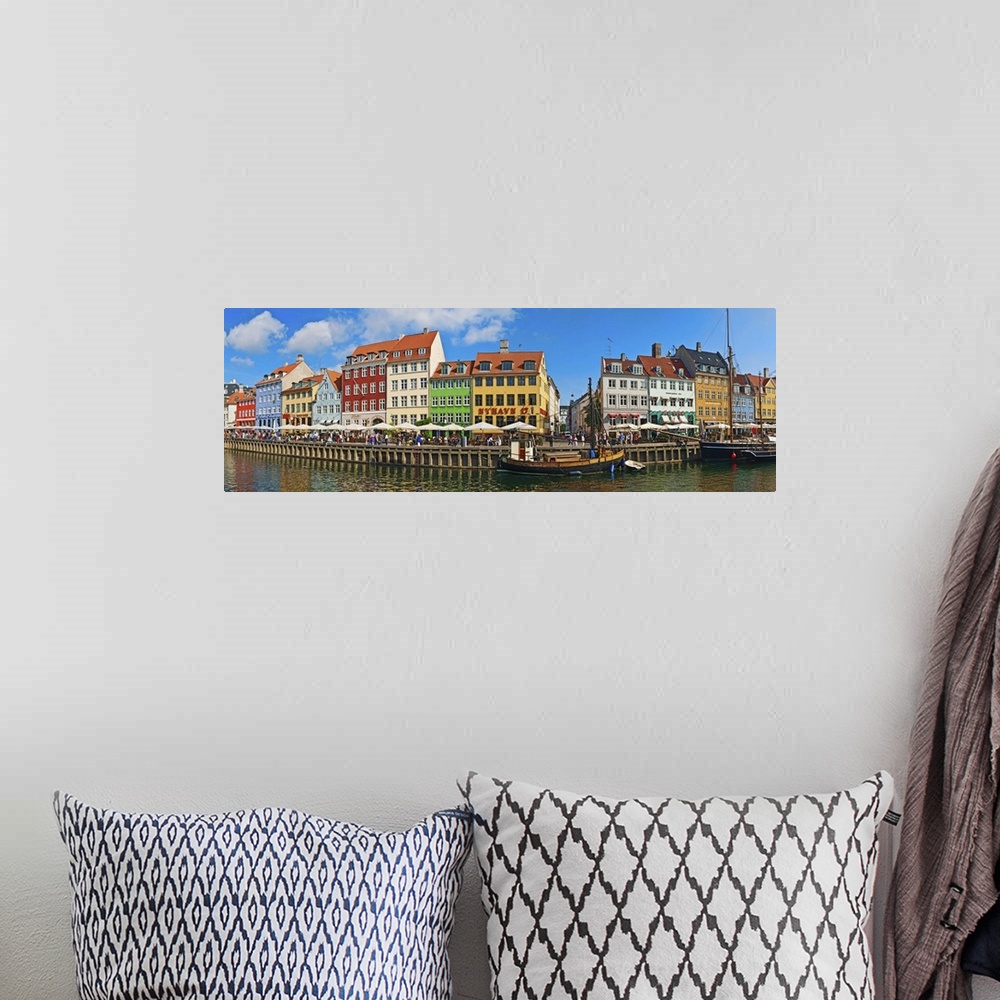 A bohemian room featuring Buildings along a canal with boats, Nyhavn, Copenhagen, Denmark