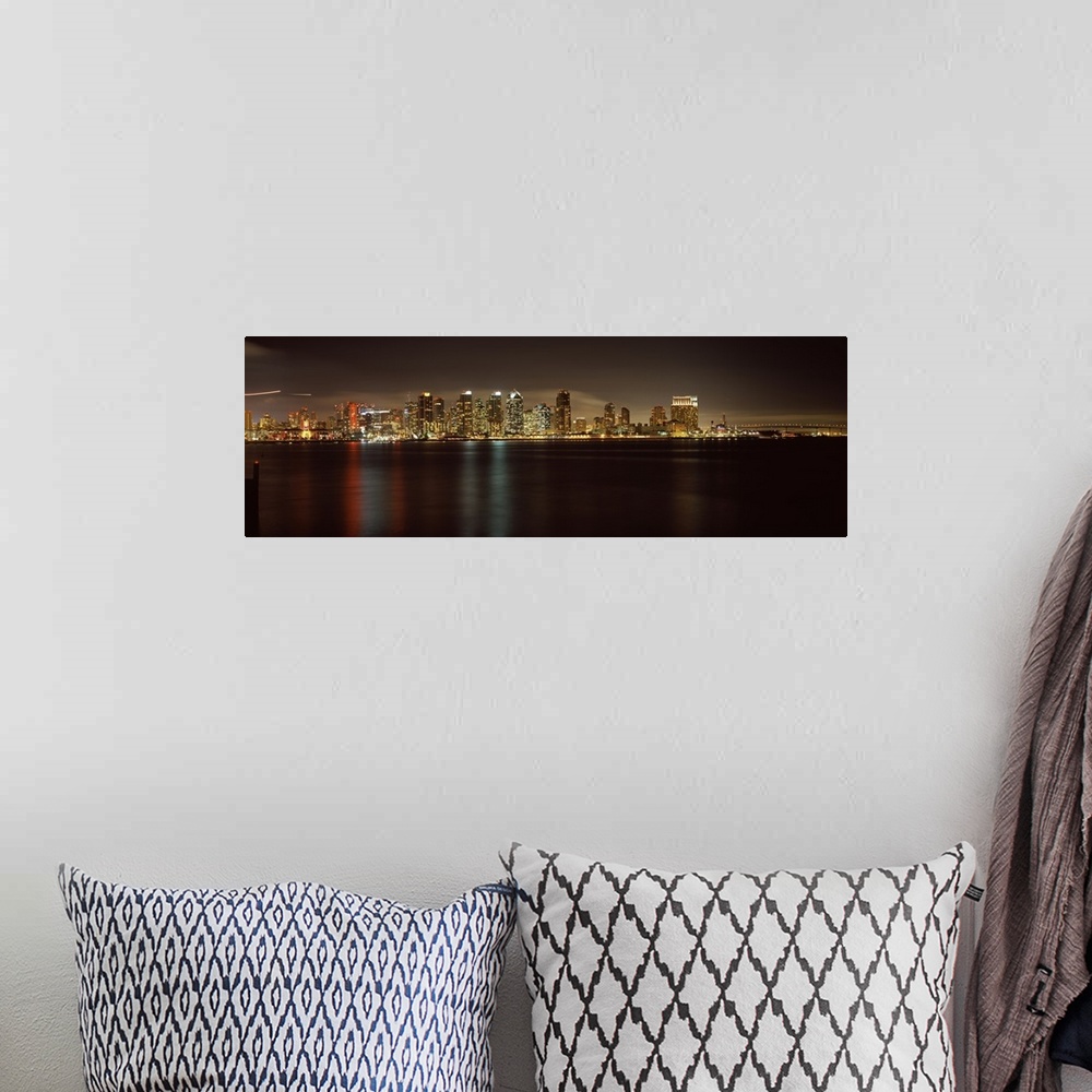 A bohemian room featuring Panoramic photograph of the San Diego city skyline along the edge of the bay in the evening, the ...