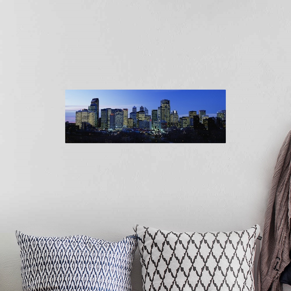 A bohemian room featuring Buildings in a city lit up at dusk, Calgary, Alberta, Canada
