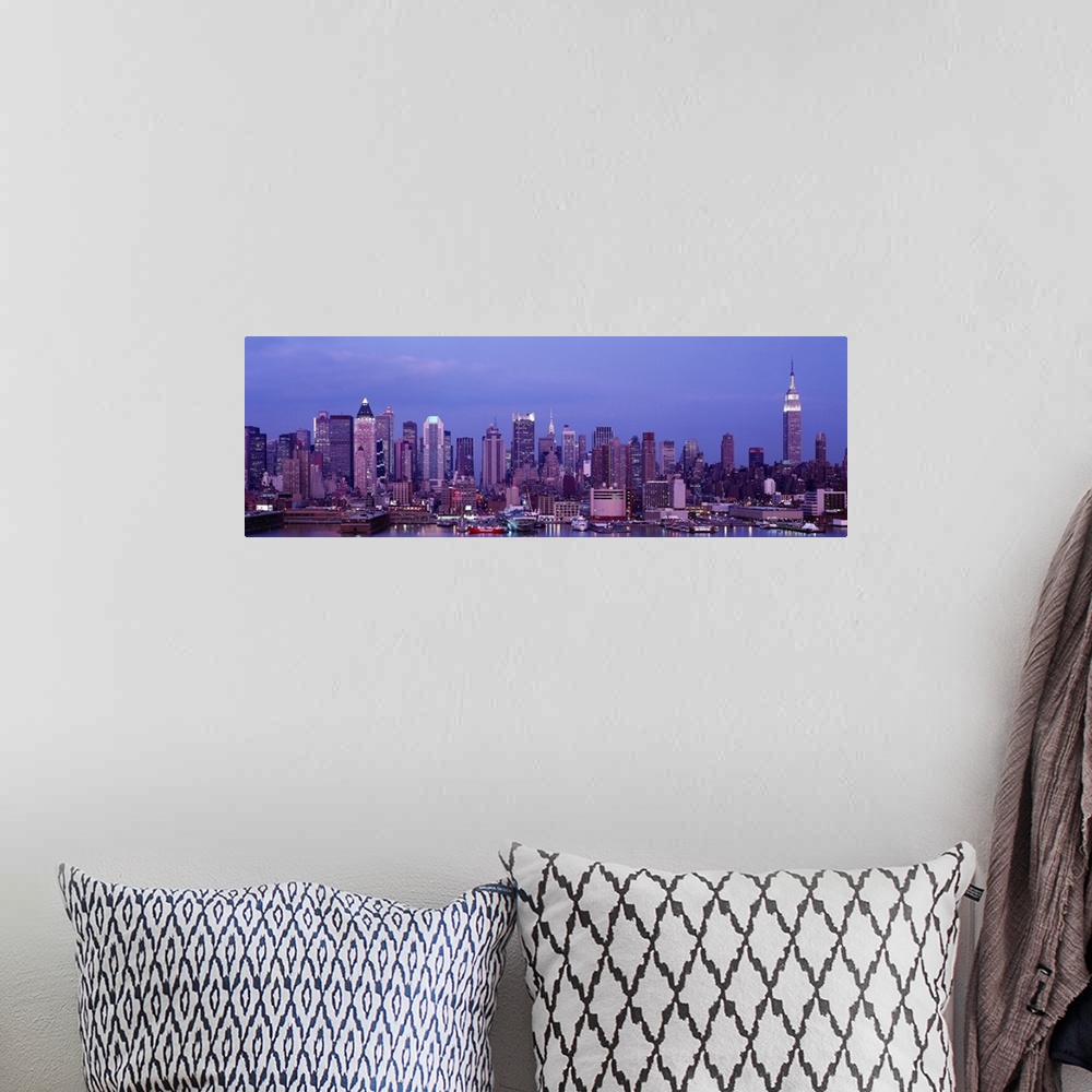 A bohemian room featuring This panoramic photograph was taken at dusk of the Manhattan skyline from across the water.