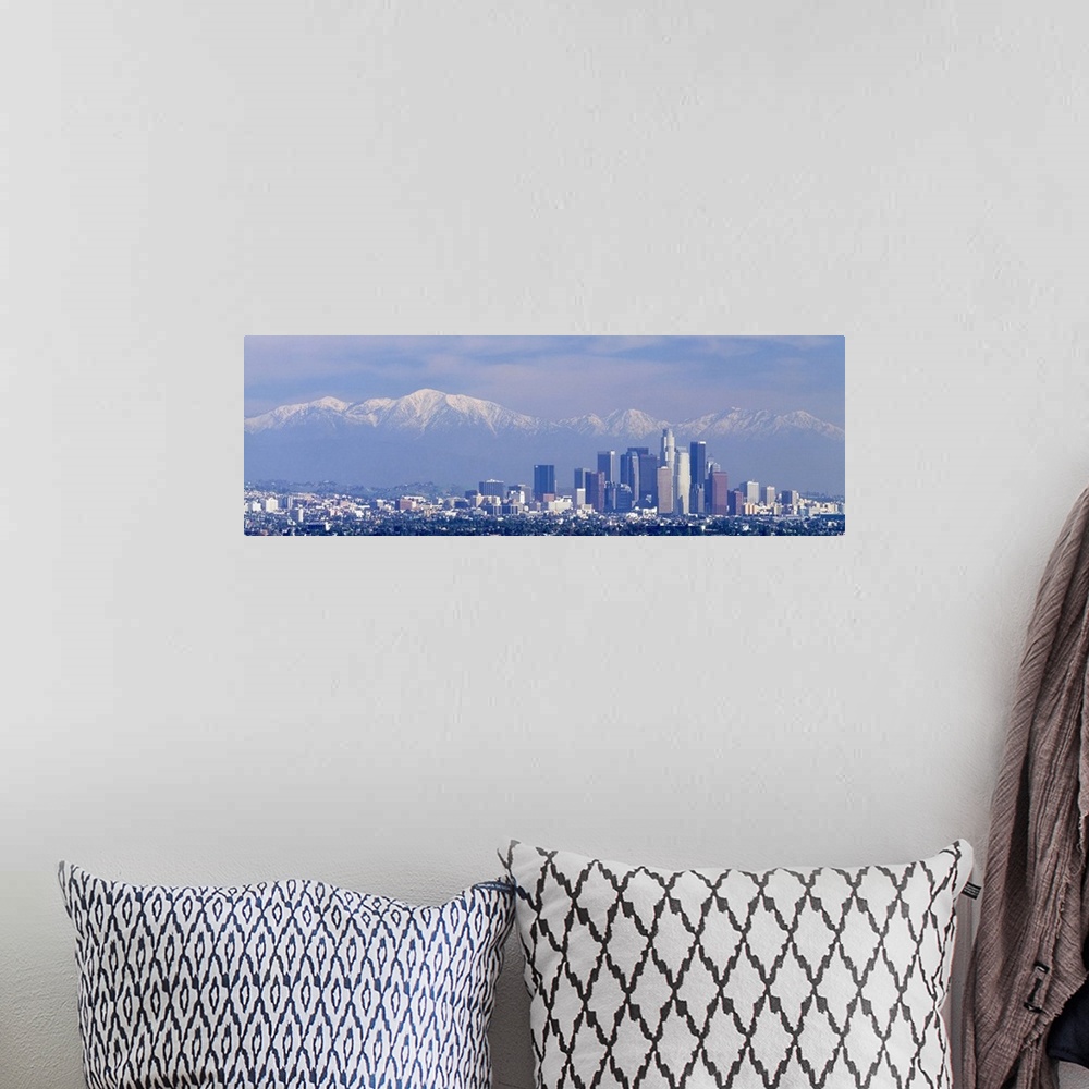 A bohemian room featuring Buildings in a city with snowcapped mountains in the background, San Gabriel Mountains, City of L...