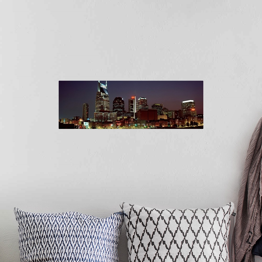 A bohemian room featuring Panoramic wall art for the home or office of high rise buildings in the Nashville skyline at night.