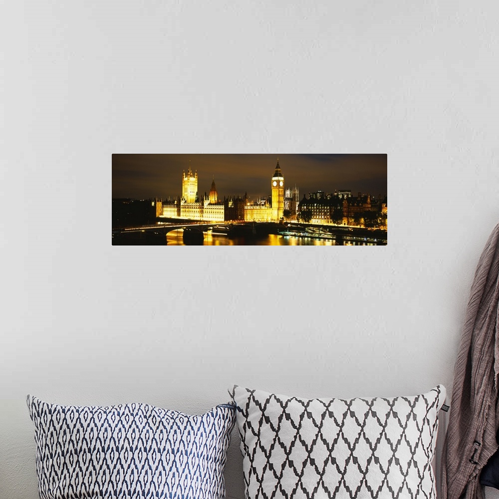 A bohemian room featuring This panoramic piece shows the Big Ben clock tower and the House of Parliament illuminated under ...