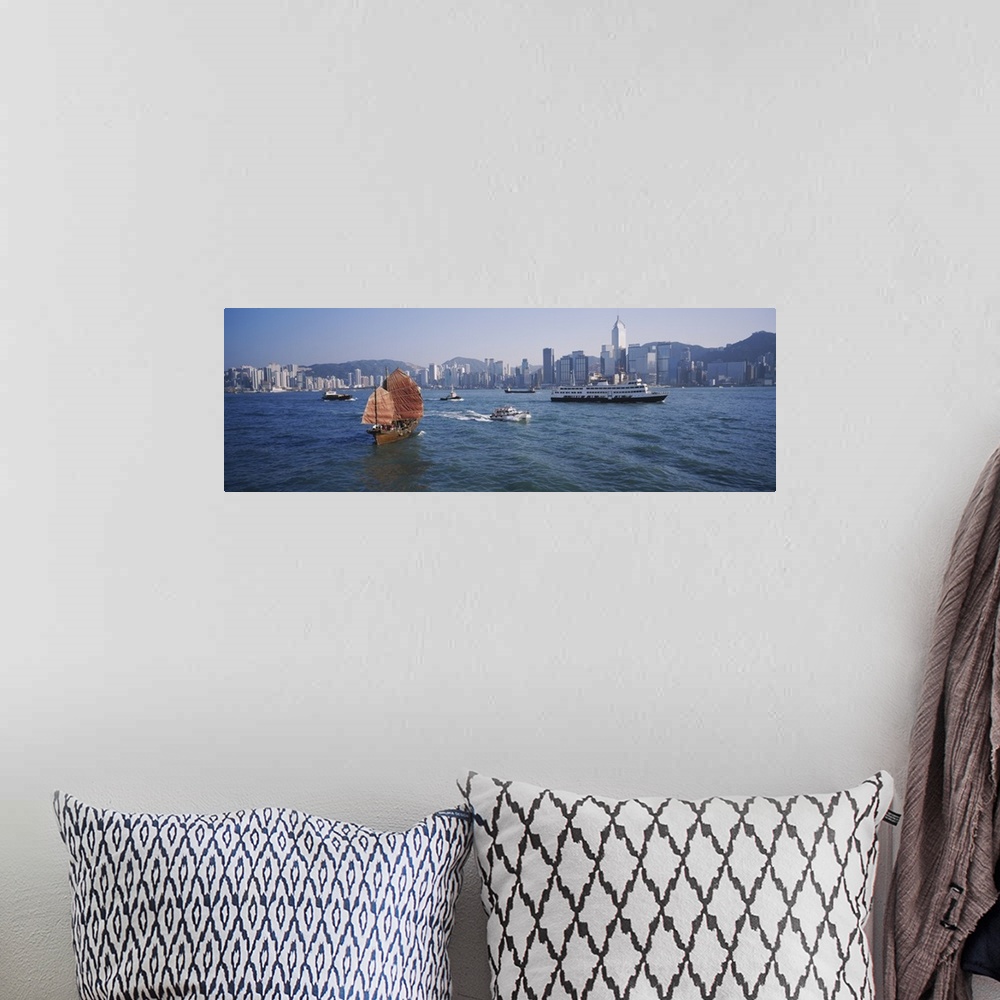 A bohemian room featuring Panoramic print of ships sailing in the ocean with a downtown cityscape in the distance meeting t...