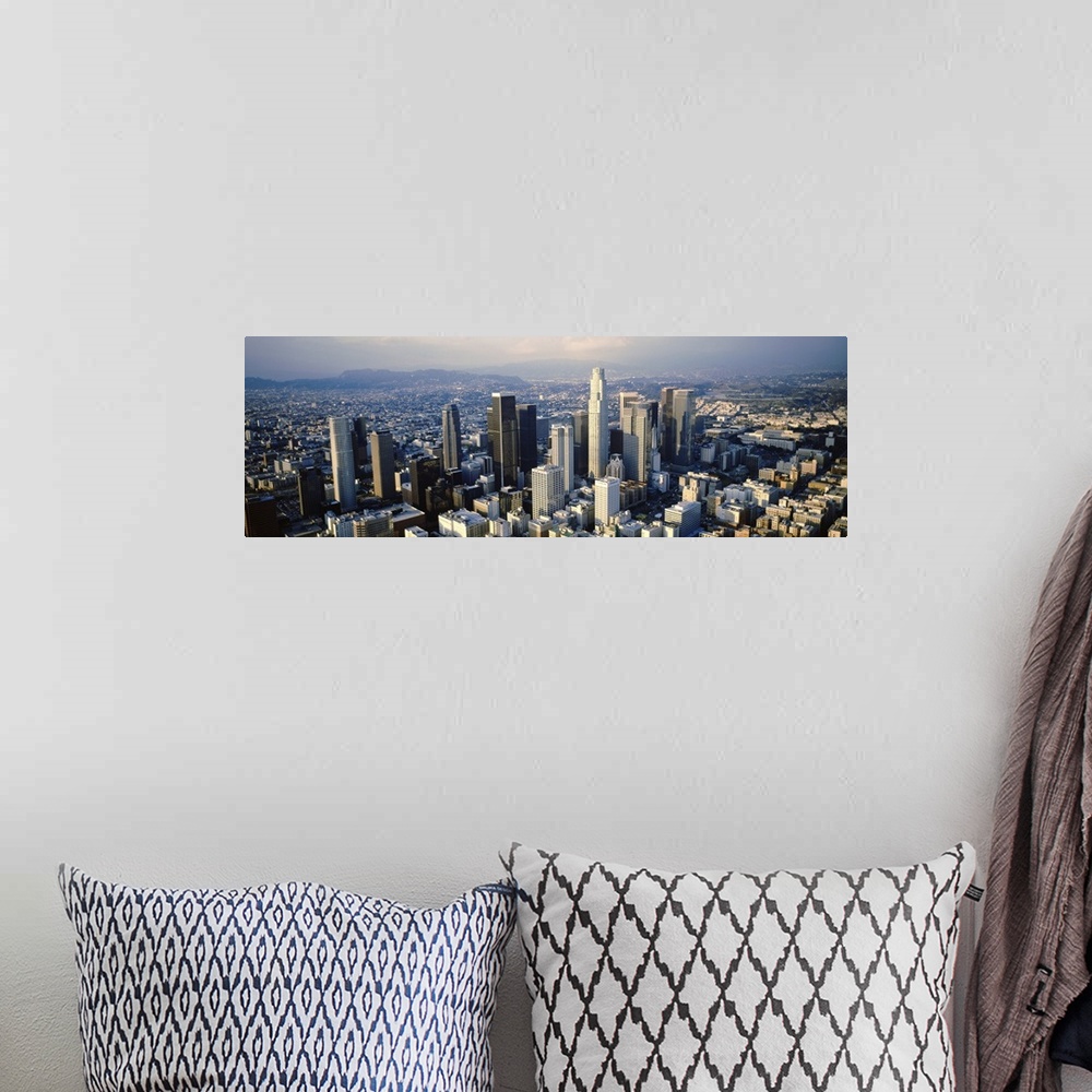 A bohemian room featuring Wide angle, aerial photograph on a big canvas of the city of Los Angeles beneath a slightly hazy ...
