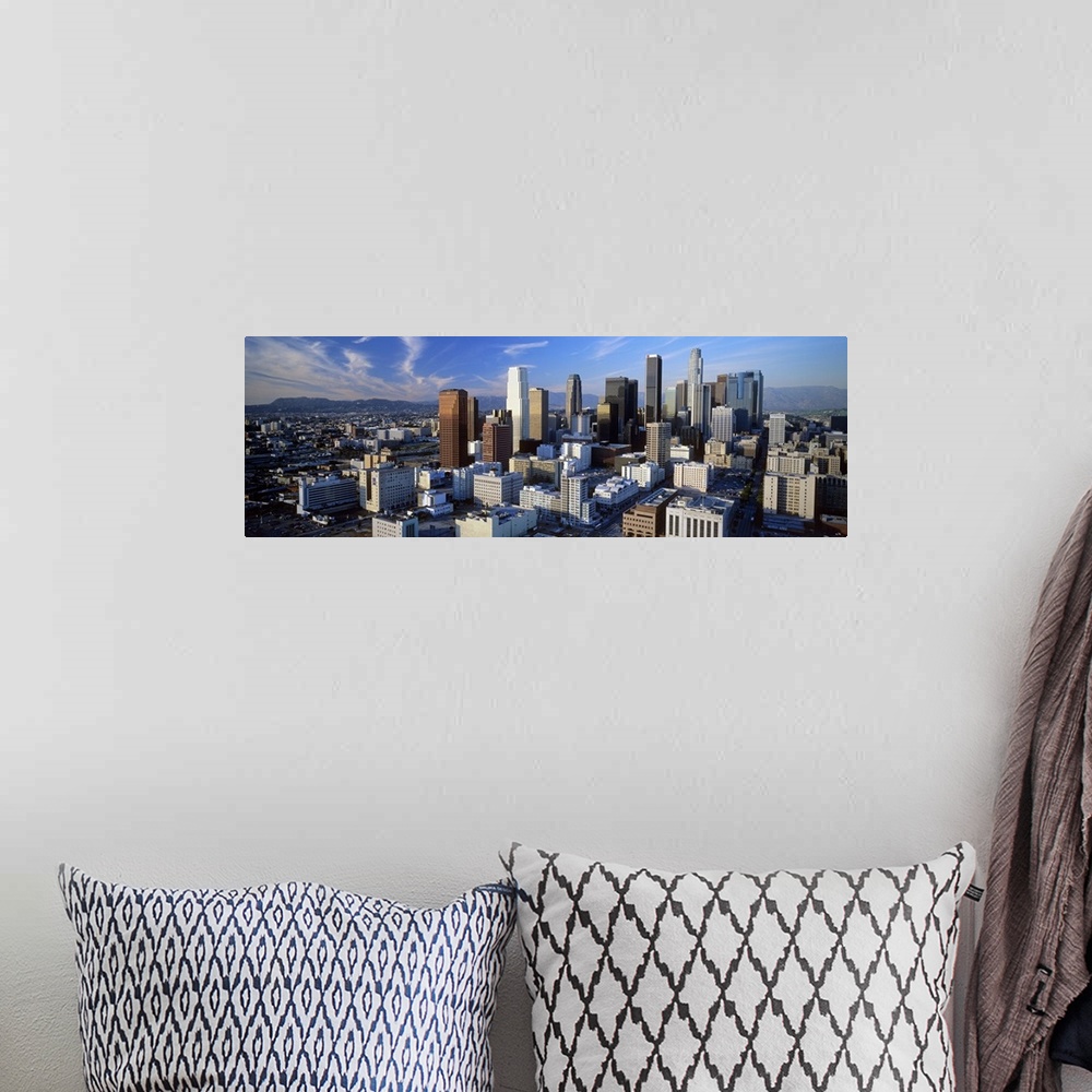 A bohemian room featuring An aerial panoramic photograph taken of downtown Los Angeles as the sun sets and hits the sides o...