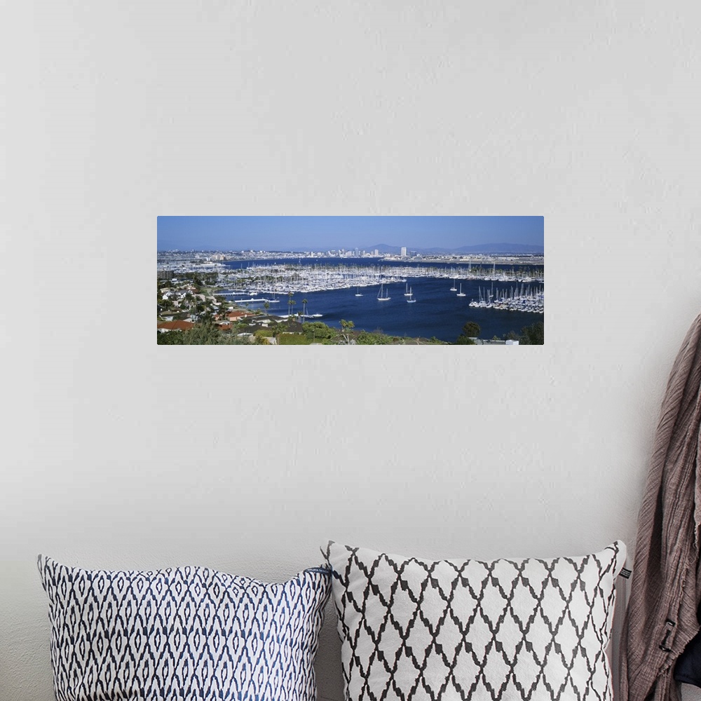 A bohemian room featuring A panoramic aerial view of the boats in the water of San Diego harbor.
