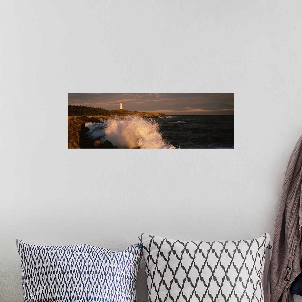 A bohemian room featuring Canada, Nova Scotia, Cape Breton Island, Waves breaking on the rocks near Louisbourg lighthouse