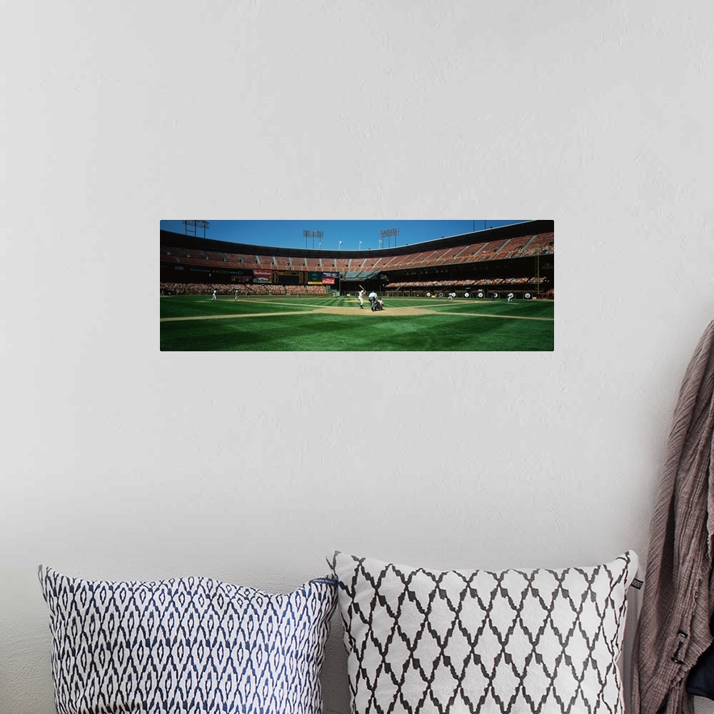 A bohemian room featuring Panoramic image on canvas of a baseball stadium as seen from the field behind the batter.
