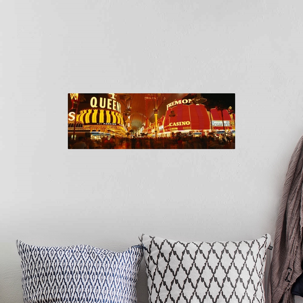A bohemian room featuring Wide angle photograph on a giant canvas of the casinos with bright lights at night, along Fremont...