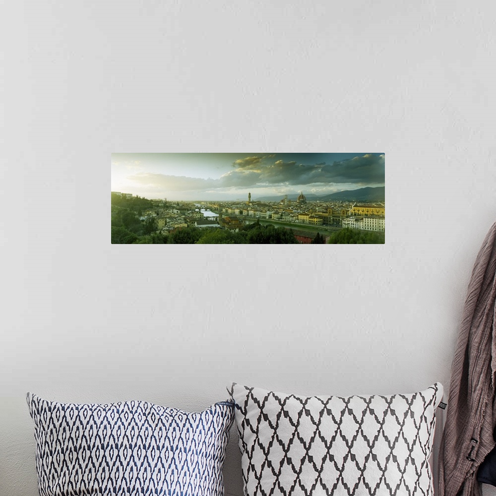 A bohemian room featuring Panoramic photograph taken from an aerial view overlooking a busy city within Europe.  In the dis...